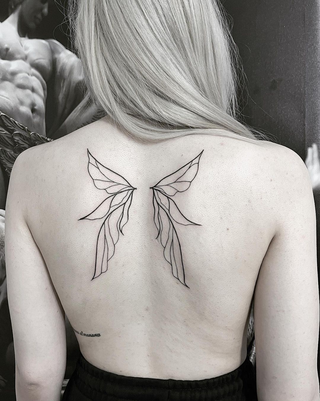 Aggregate 102+ about angel wings tattoo meaning best .vn